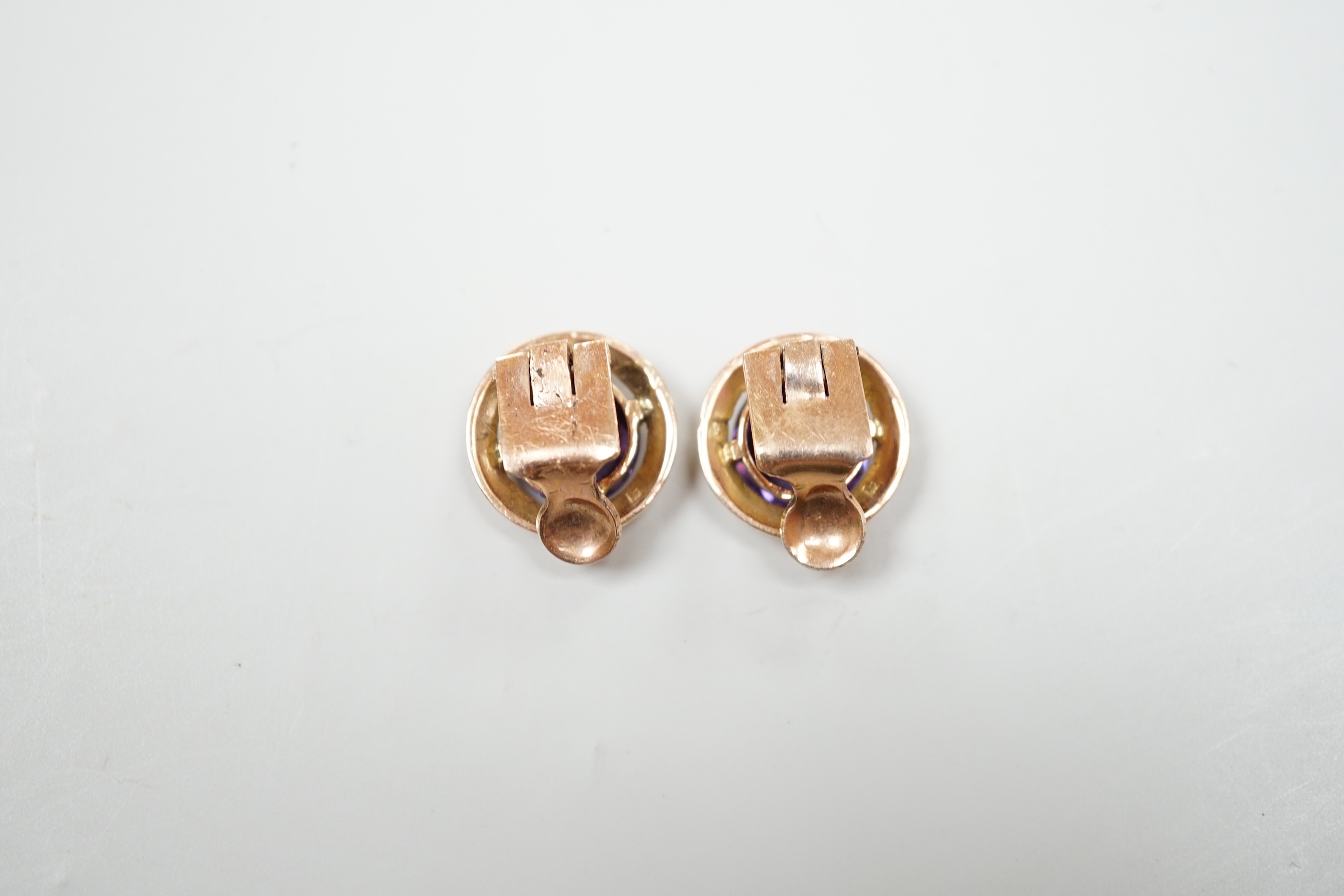A pair of rose gold mounted alexandrite ear clips, 1.75cm, gross 8 grams